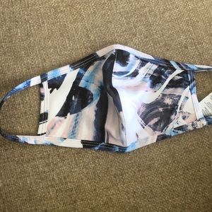 One Fabletics Face Mask.  New in sealed bag.